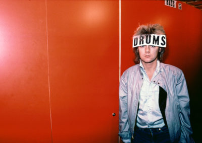 Roger Taylor with ‘Drums’ sticker on head - Musicland studios Munich - 1980